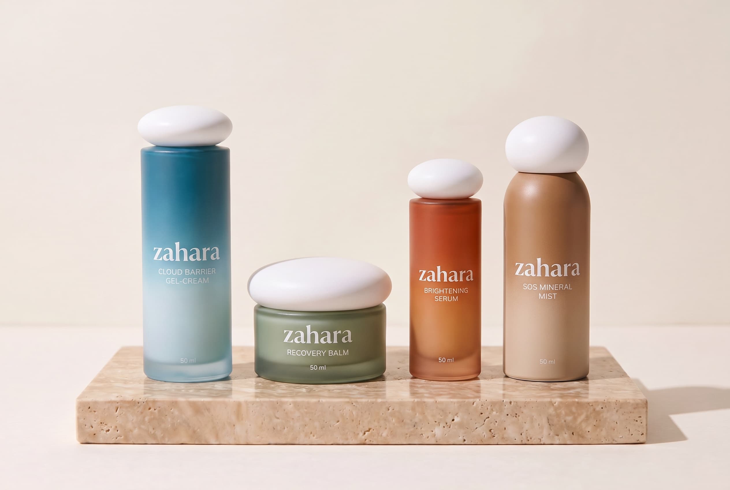 Zahara skincare product system on a warm ivory shelf.
